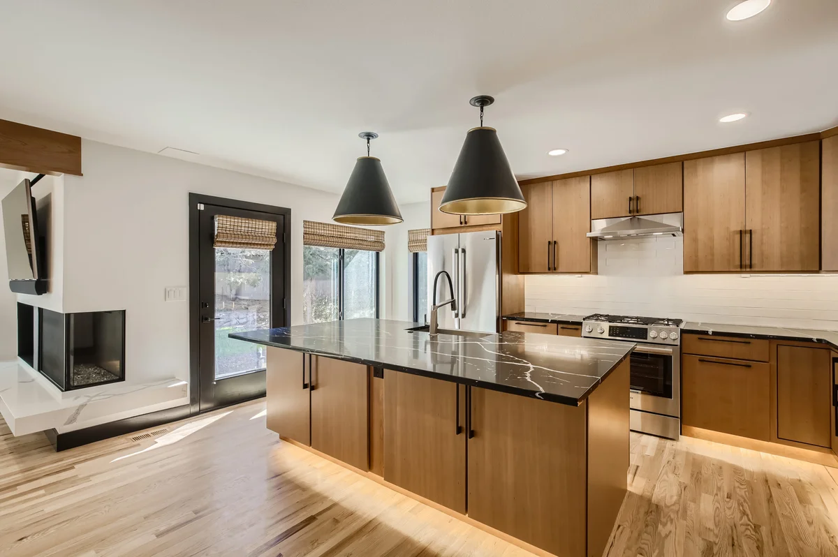 High-end Boulder kitchen remodel by DG Home Pro with stone counters and custom cabinetry